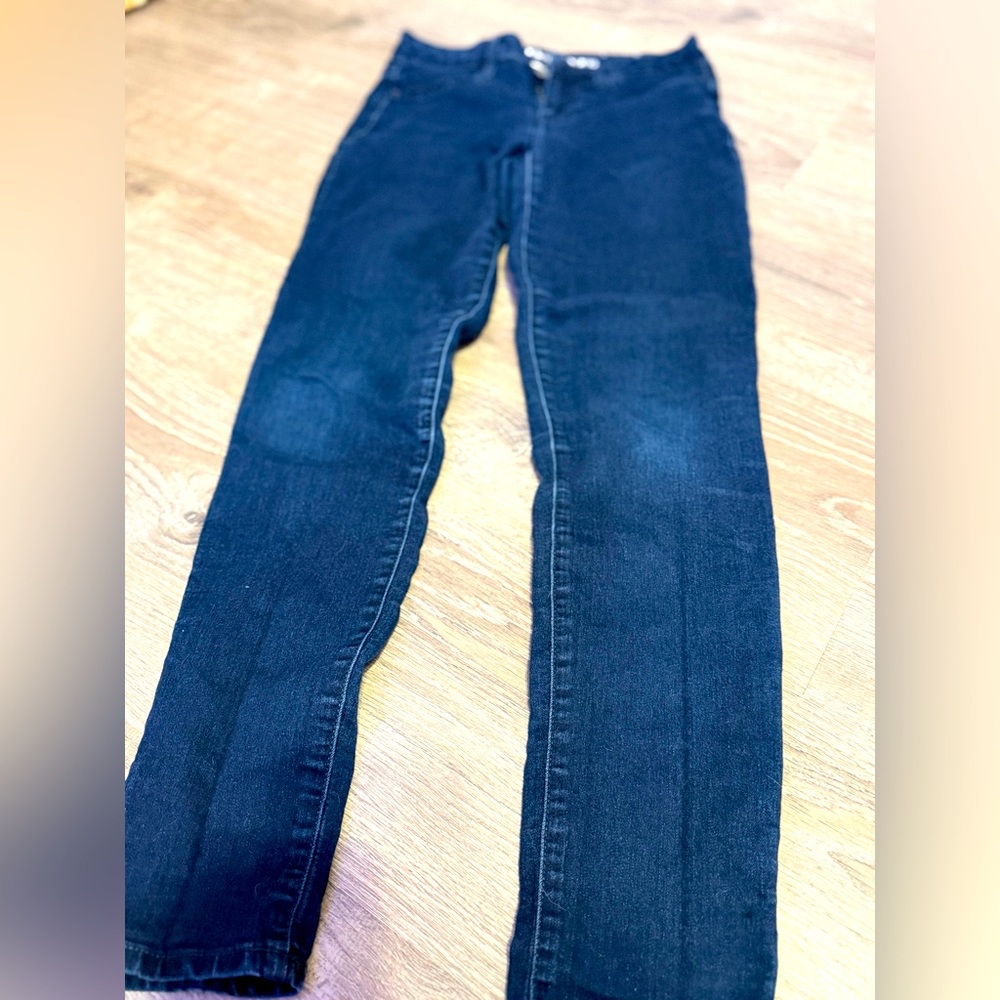 Calvin Klein Jeans branding on the waistband and a leather logo patch on the bac